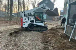 Subgrade prepared for concrete patio installation in Old Grand Beach by C Corona Construction